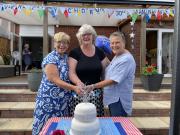 Helen, Deborah & Trudy cutting THE CAKE!